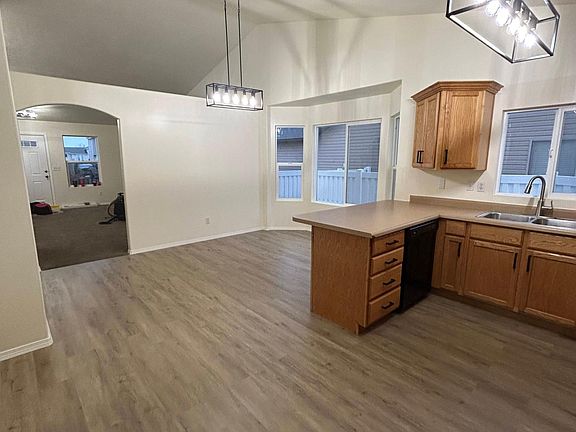 view from back door through kitchen, dining, and family room