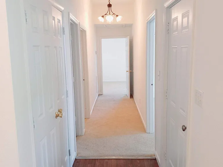 Left: Laundry area; main bath; bedroom. Bedroom/office in rear. Right: Entry; Master Bedroom/bath