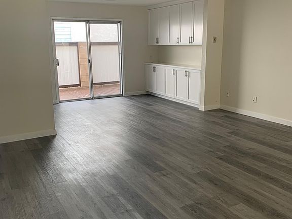 Unit #1 Living Room & Dining Area with Private Patio Entry