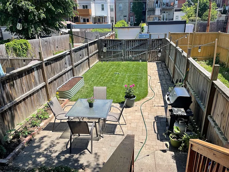 Large backyard with good shade from holly tree.