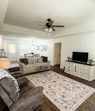 Spacious living room at the front of the house divides master suite from the other 2 bedrooms