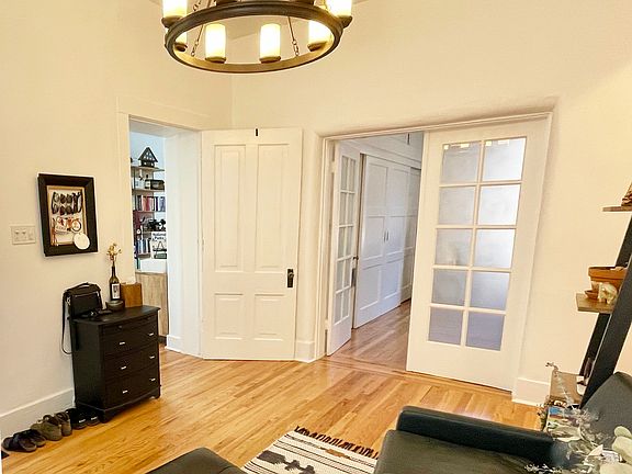 ENTRY/OFFICE/SITTING ROOM - Stunning light fixture with lots of charm.