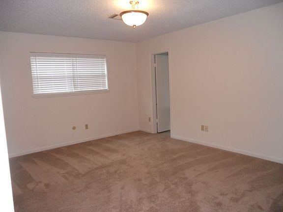 Master bedroom w/ new carpet, paint & blinds