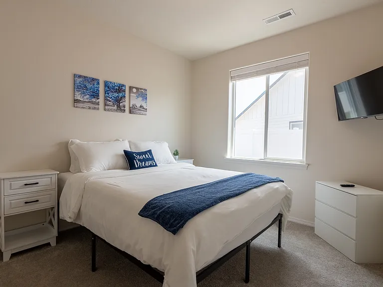 Queen Bed in Guest Room. Roku TV