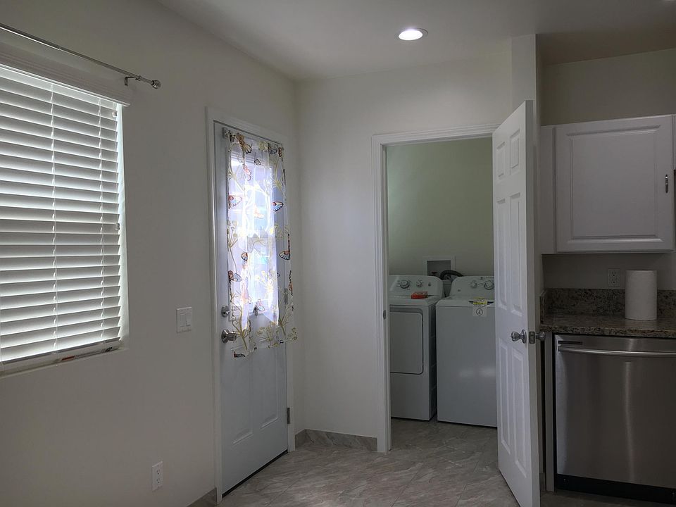 Laundry room next to kitchen!