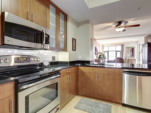 Open kitchen on entering, leading to dining area and sitting room, with first bedroom to immediate right and with master bedroom at the end and on the right.