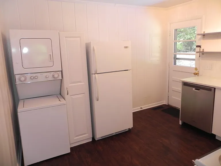 kitchen with fridge and washer-dryer