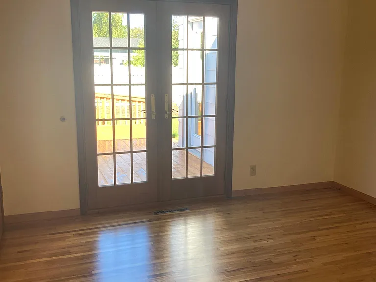 Third bedroom with French doors leading out to deck.