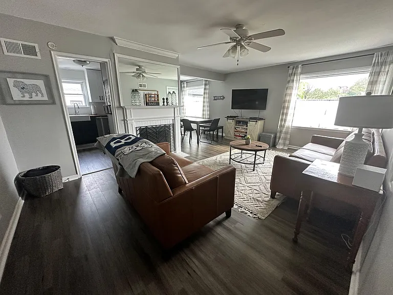 living room which connects to dining room and kitchen