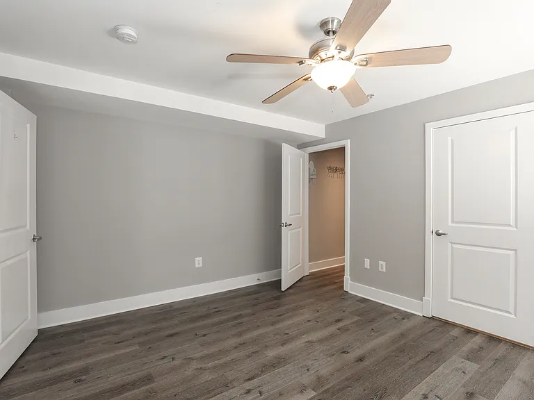 Large Bedroom with Ceiling Fan and Closet Space