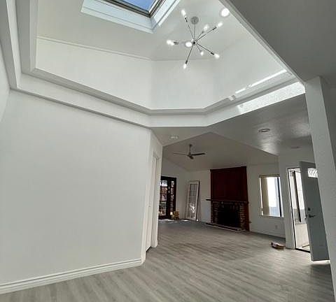 Dinning room with Vaulted ceilings and sky light