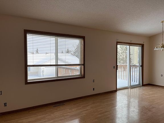 Dining and living room in view of kitchen