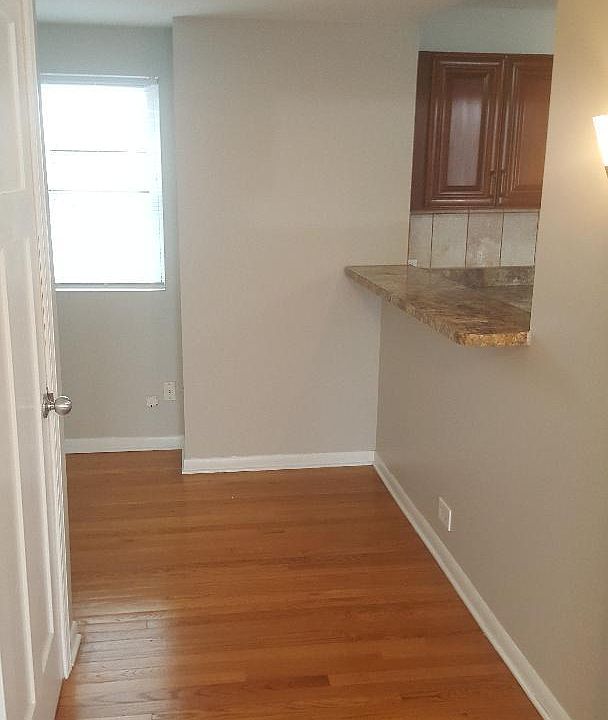 counter eating area. clothes closet on left.