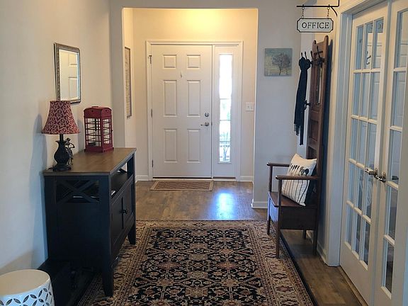 Entry and office entrance on right with French doors