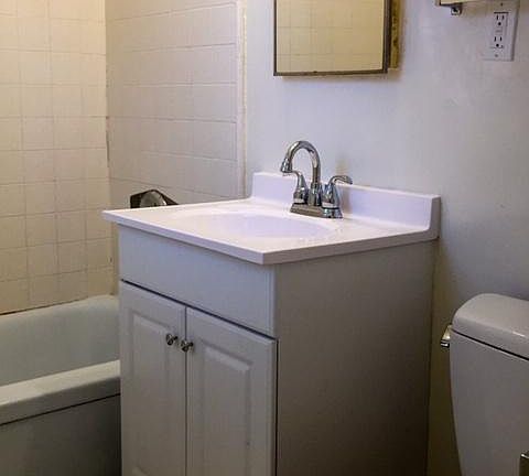 Bathroom with new vanity, tub and shower head