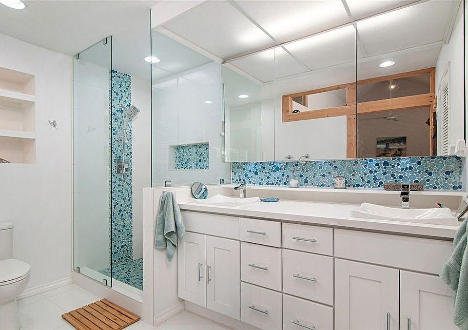 Remodel master bathroom. Seat in shower area. Double sinks.