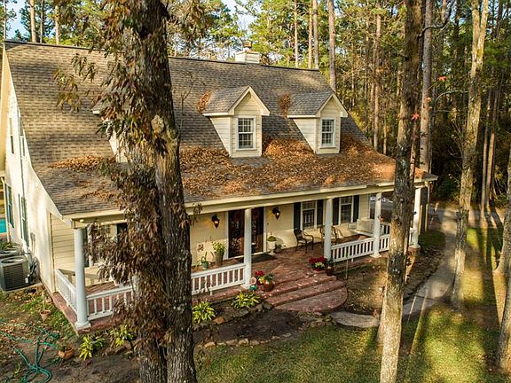 COMPLETELY UPGRADED! Built in 1999, but the current owners invested $265k in renovations. The home sits on 5.75 acres, has a 5,000+ square foot barn, and a separate Guest house.