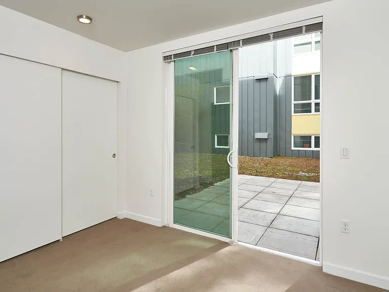 Carpeted Bedroom and Patio
