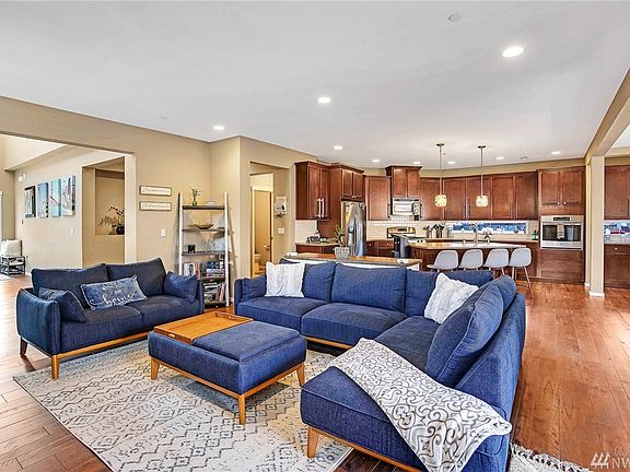 Gatherings will be a delight in the large great room that combines the living room, dining room, and kitchen.