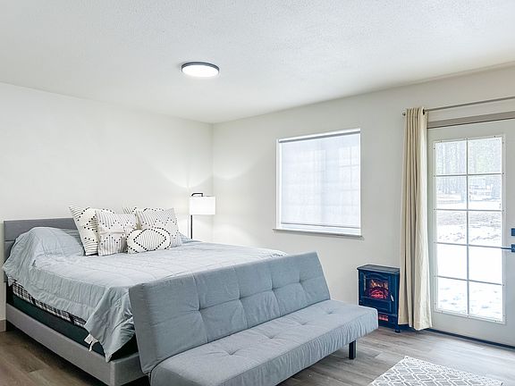 comfy futon for watching your favorite shows on the provided smart tv.