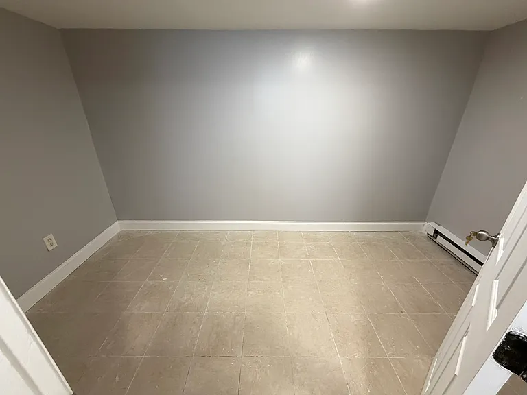 Basement room used for extra storage or WFH set up