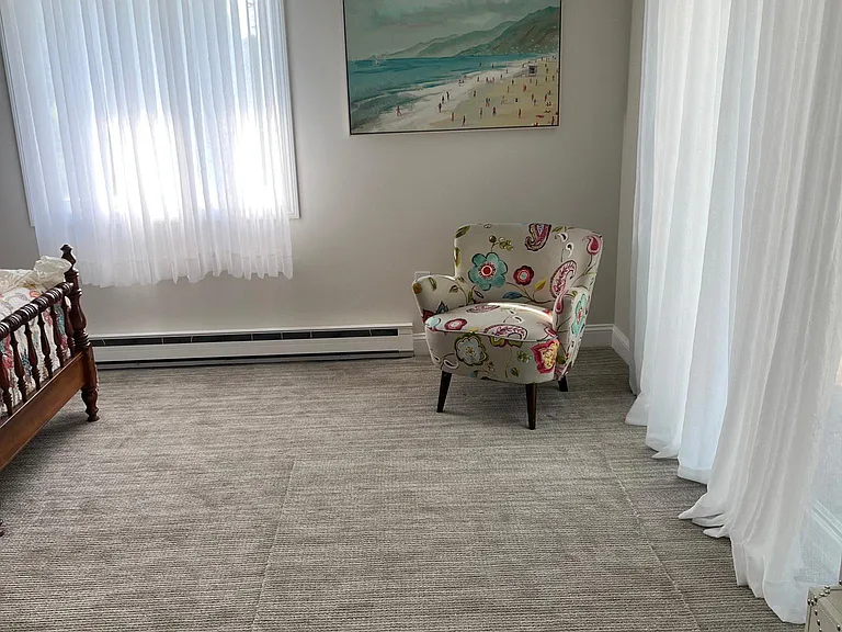 Twin bedroom with new rug