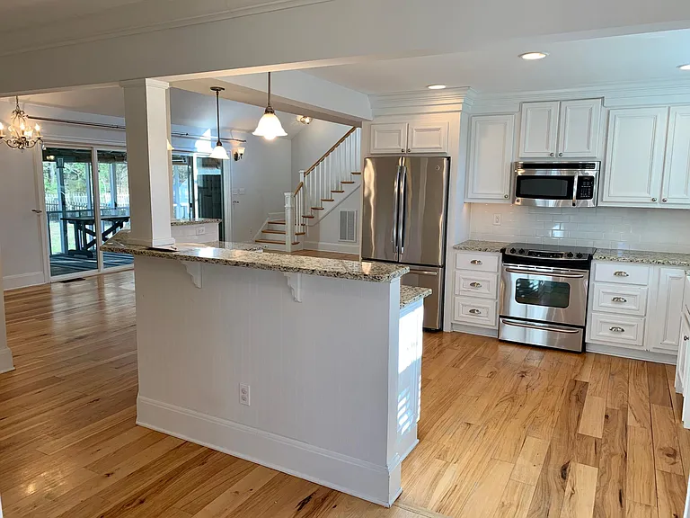 View of kitchen from entrance area. Kitchen and great room are open to one another, with space concentrated where you'll use it the most.