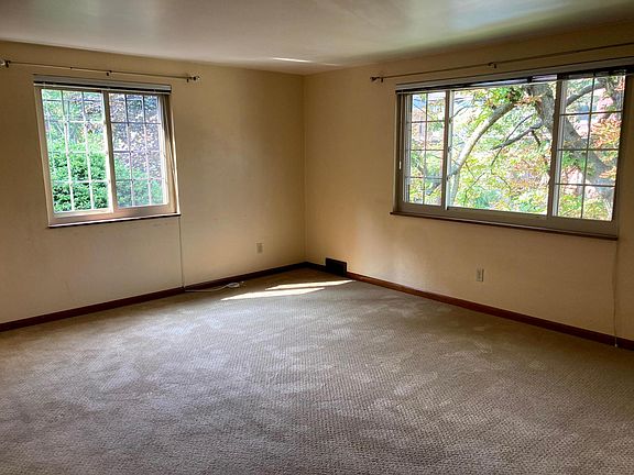 Large living room with big windows, lots of light and great views!