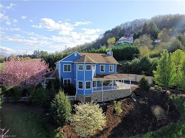 Lush landscaping, koi pond, fruit trees and simple beauty abound!