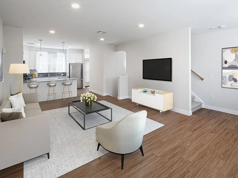 Phase II Renovated Package I townhome living and dining area with hard surface flooring