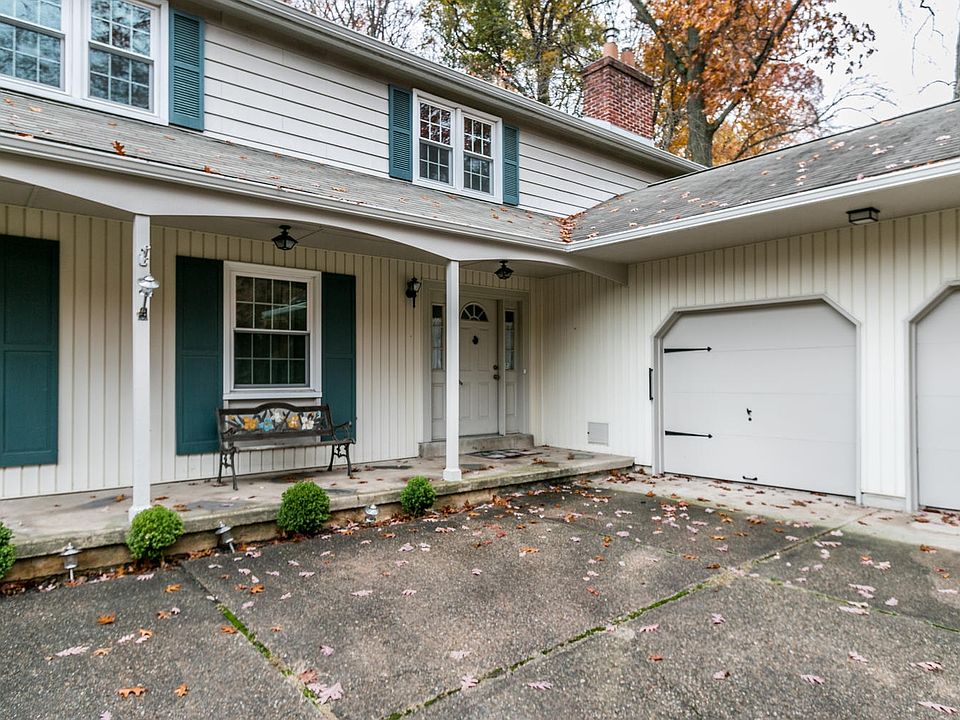 Covered porch and turned 2-car garage