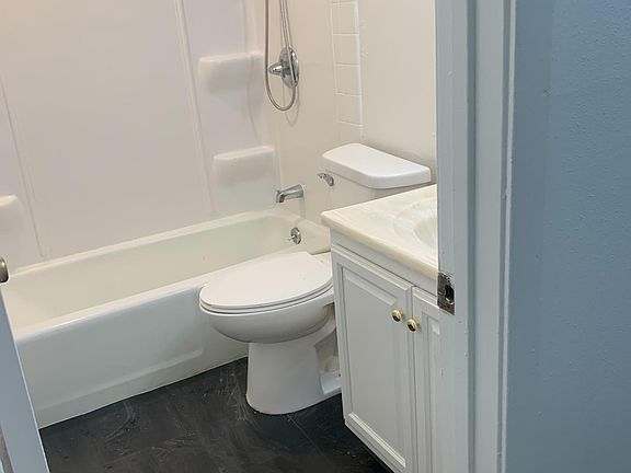 Updated bath with luxury vinyl stone composite flooring