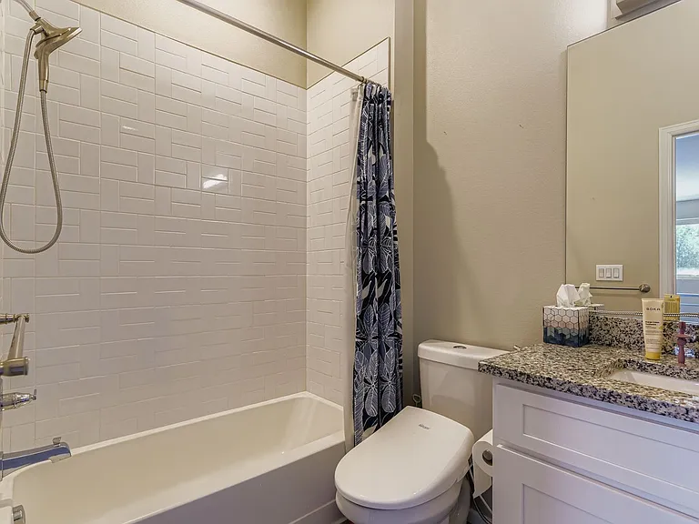 Upstairs secondary bathroom with shower/tub combination and bidet toilet cover