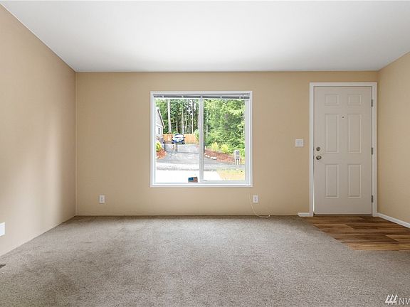 Hardwood entry and soft neutral designer color walls..so easy to decorate with and add your personal touches