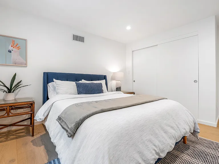 Stylish bedroom with plenty of natural light and modern comforts.