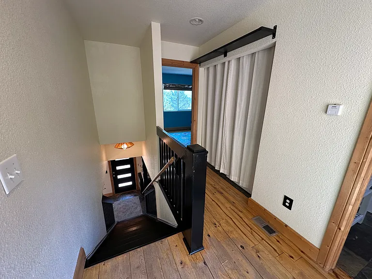 Upstairs hallway (washer and dryer behind curtain)