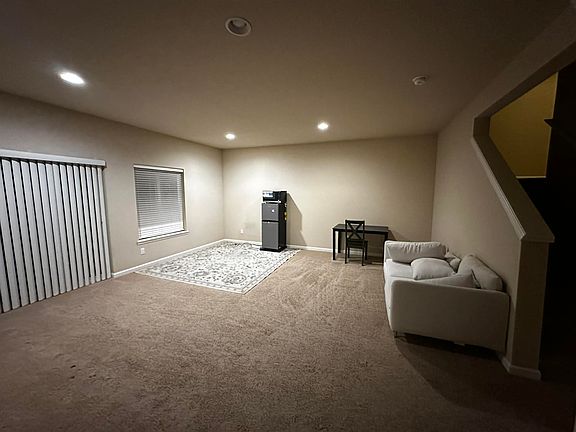 Living Room showing Refrigerator, Microwave and Couch (Photo 2)