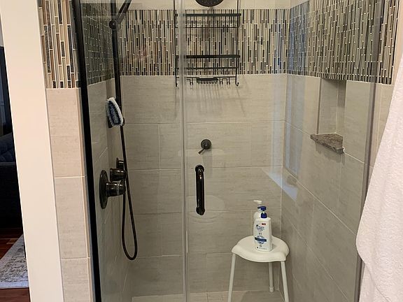 Shower with multiple heads and tankless water heater.