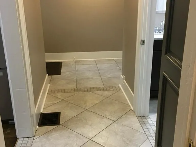 Mud room with the second full bath downstairs. Washer and dryer included
