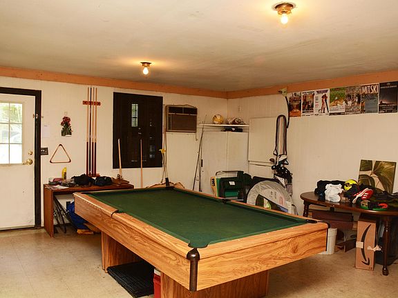 Entry room off driveway w W/D. Pool table has moved on, alas.