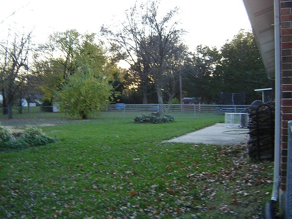 Almost 1/2 acre fenced yard with large patio