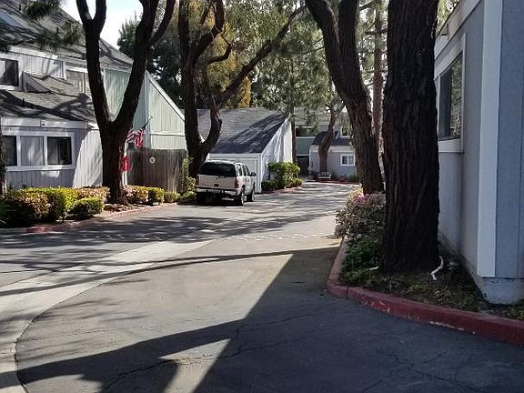 Sea Breeze is a beautifully maintained complex with mature trees, located adjacent to Victoria Bluffs and the border of Costa Mesa & Huntington Beach. 1035 is the first unit on the right.