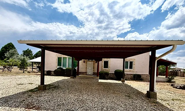 front of house with large carport