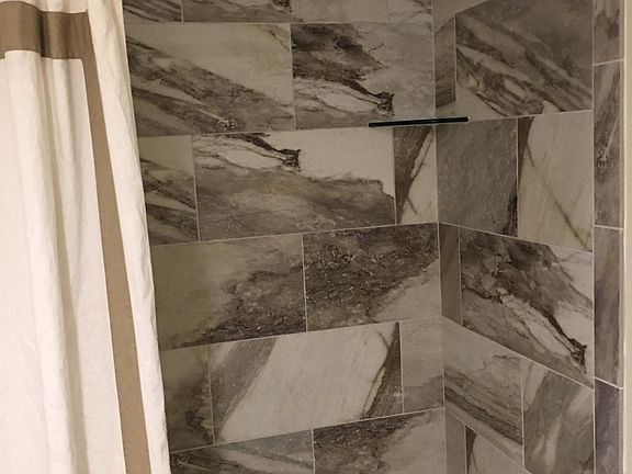 Guest bathroom with tub and shower