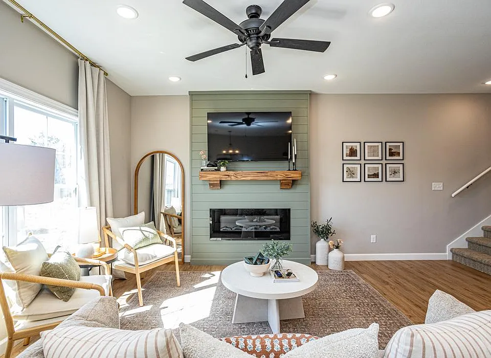 living room featuring open concept layout, decorative mantle and electric fireplace
