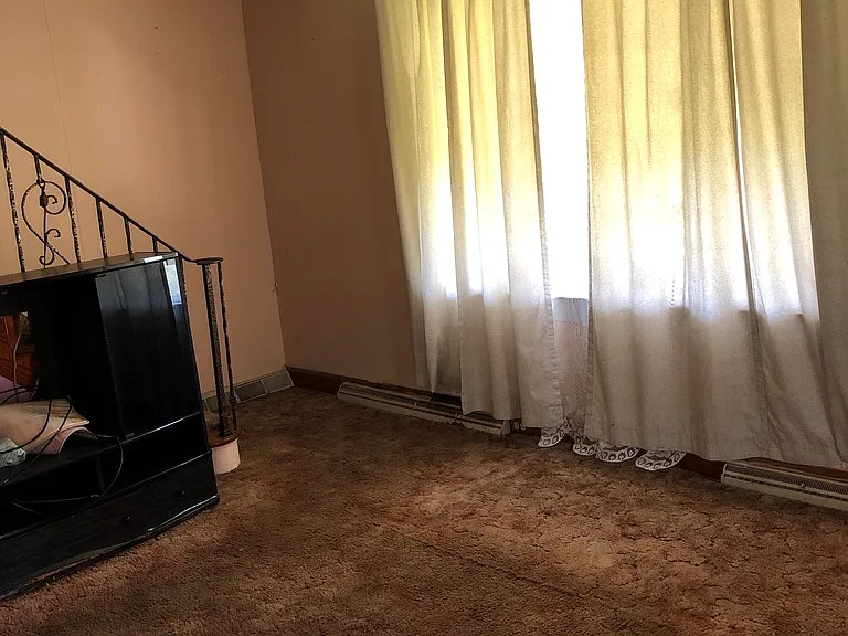 Living room now has refinished hardwood floors
