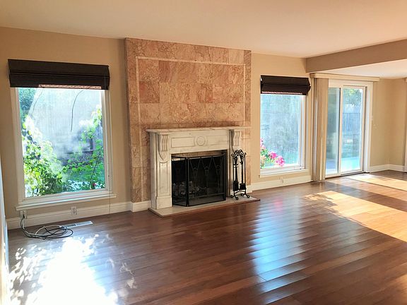 Family room with fireplace and plenty of natural light.