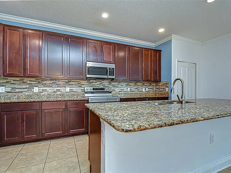 Note: Kitchen accent wall has since been professionally repainted to match the updated interior color scheme. Updated photos coming soon.