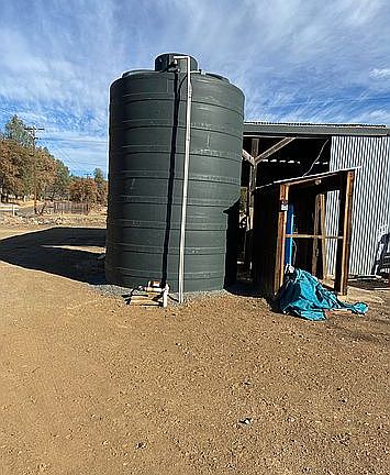 Water storage tank for well
