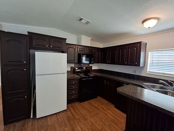 Open concept kitchen facing the living room and front door